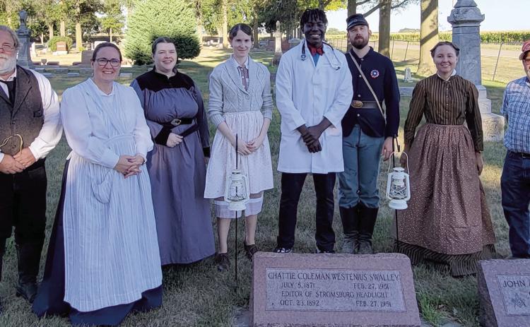 History came alive at the Stromburg Cemetery as Tim Teegerstrom (left), Beth Sparrow, Lauran Ostberg, Megan Sothan, James Elgin, Michael Sothan, Kelsey Patton and Mayor Ken Everingham portrayed noteworthy Stromsburg residents for the Cemetery Tours.