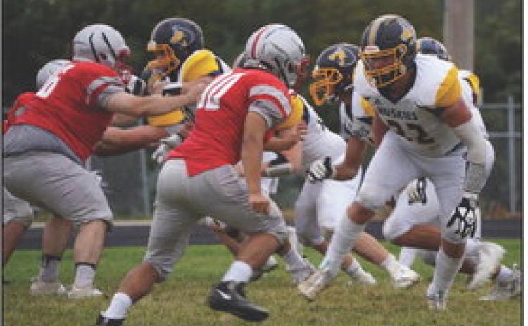 Collin Vrbka stares down his man on defense at Madison. PCN photo by Jen Vrbka.