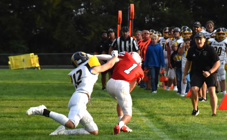Jett Vrbka goes for the tackle on Cougar Connor Rempe. PCN photo by Beth Sparrow.