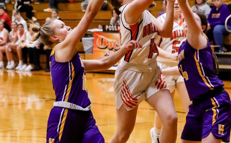 Addison Theis takes the ball up away from Hampton defenders. PCN photo by Blaine Winslow.
