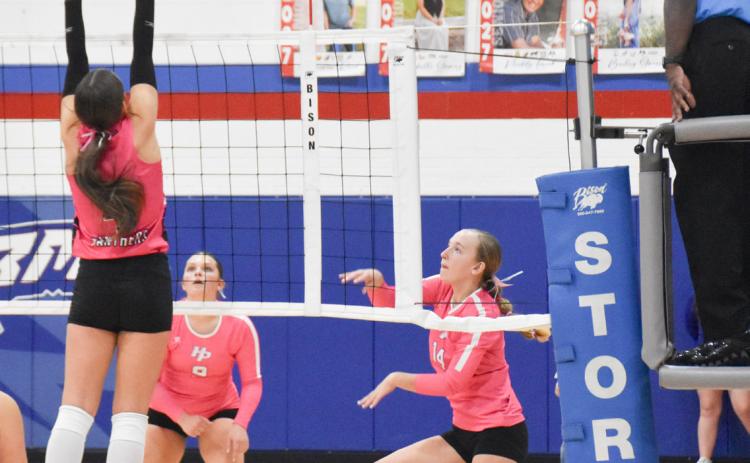 High Plains freshman Peyton Van Pelt send the attack over the Fillmore Central block set up. PCN photo by Beth Sparrow.