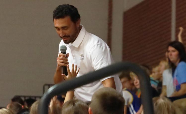 Children’s Author Brody Kelley talks with the students at High Plains Elementary in Clarks last Tuesday. Kelley talked about how when he was young he would create his own books and even shared some of his illustrations with the students. Kelley is a teacher in Albion. PCN photo by Ken Kush.