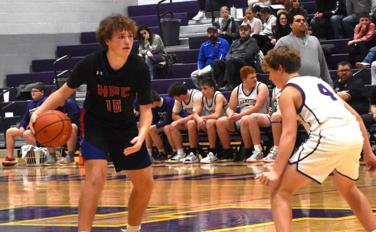 Chase Owens dribbles the ball while a Hampton defender gets ready for the next play. PCN photo by Beth Sparrow.