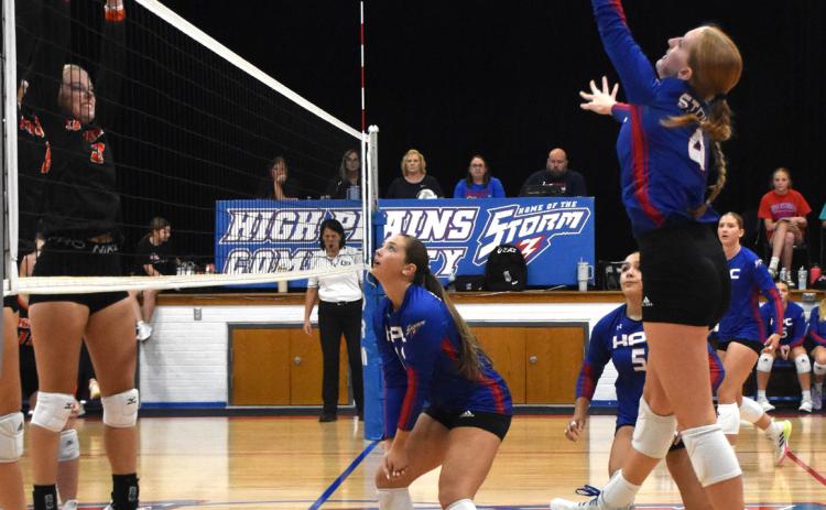 Peyton Hofmann jumps for the kill against Dorchester. PCN file photo by Beth Sparrow.