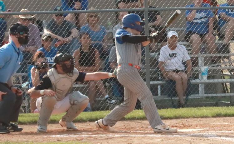 Twin River Titans Aden Feezell drills a line drive single to centerfield in the bottom of third. Feezell had two hits in the loss. PCN photo by Ken Kush.