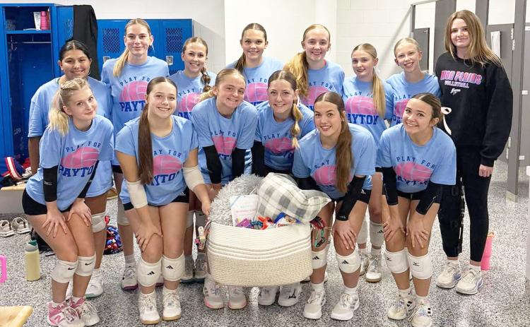 The Palmer volleyball team presented the High Plains volleyball team pet products for Payton Ackerson’s Paws for Payton. Photo was provided