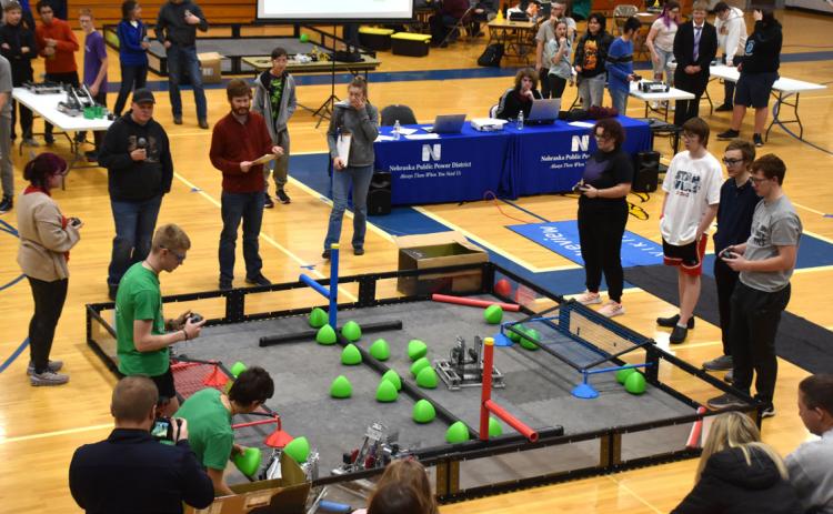 Korah Hier (back left) received the sportsmanship award at open robotics on Saturday at Columbus Lakeview. She is competing here against 5155K (Kirk Sparrow and Cannen Mooney, bottom right) and others. PCN photo by Beth Sparrow.