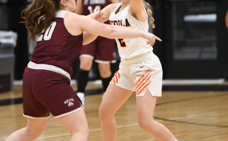 Sierra Boden plays smothering defense on St. Edward's Malaina Francis, frustrating the senior point guard all game.