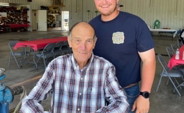 Osceola Fire Department Wing Feed and Cornhole Tournament was a benefit for Johnny Thornton and to help pay for his medical expenses. He is pictured top right with Garrett Fischer, Johnny’s grandson. Photos were provided.