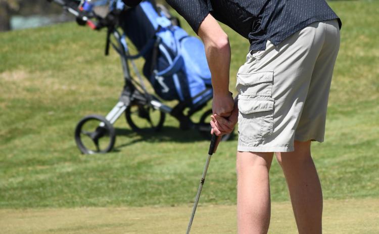 Above: Brock Allen lines up his putt. PCN file photo.