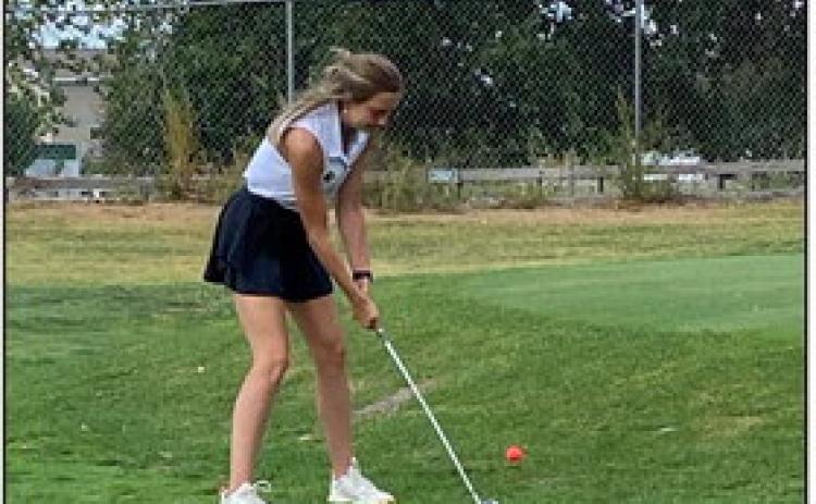 Lillian Wetjen scoops one out onto the green at their last meet. Photo provided.