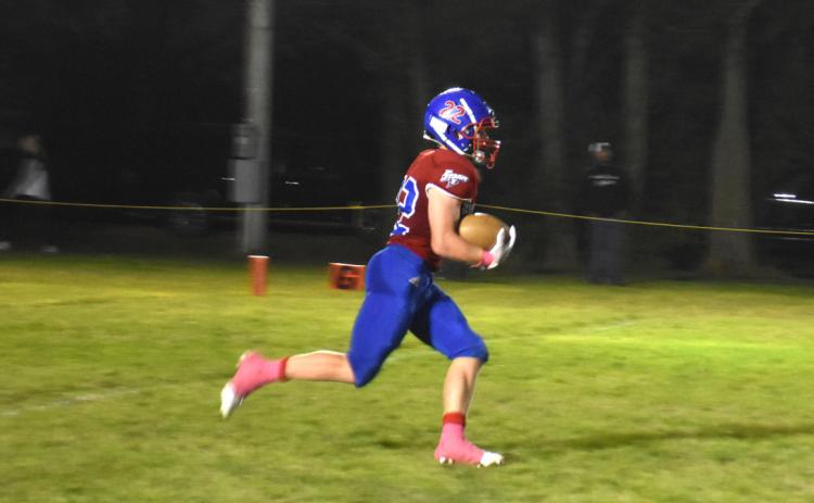 Gage Friesen runs the ball. He had 158 rushing yards and 4 touchdowns against Deshler. PCN file photo by Beth Sparrow.