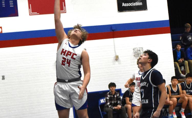 Ayden Hans puts the ball up against Nebraska Christian. PCN photo by Beth Sparrow.
