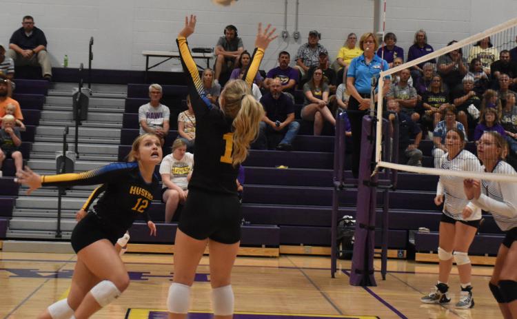 Taya Pinneo (#1) sets up the kill for Ava Larmon (#12) against the Hawks. PCN photo by Beth Sparrow.