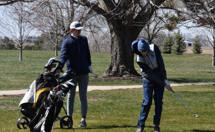 Wyatt Hengelfelt watches as Ashton Seim takes a swing. PCN photo by Cienna Friesen.