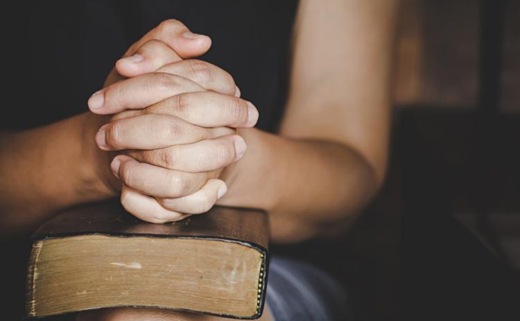 A group of local women gather to pray for our area schools. Photo illustration