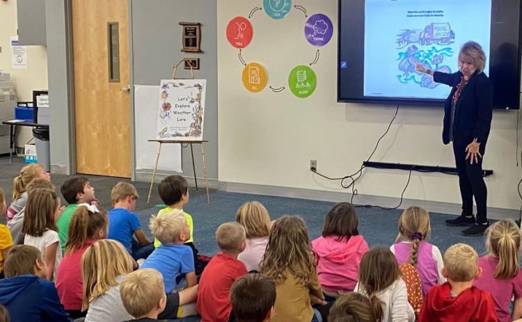 Stromsburg alumni Jan Jones came to Cross County School to promote her book 'Let's Explore Weather Lore' with author Sandra Hanson. Students enjoyed hearing about the book, how to find weather, and how animals react to it. Jones and Hanson were middle school teachers in Kearney. Their book is available from Amazon.com, Barnes and Noble and The Solid Rock in Kearney. Photo provided by Cross County School.