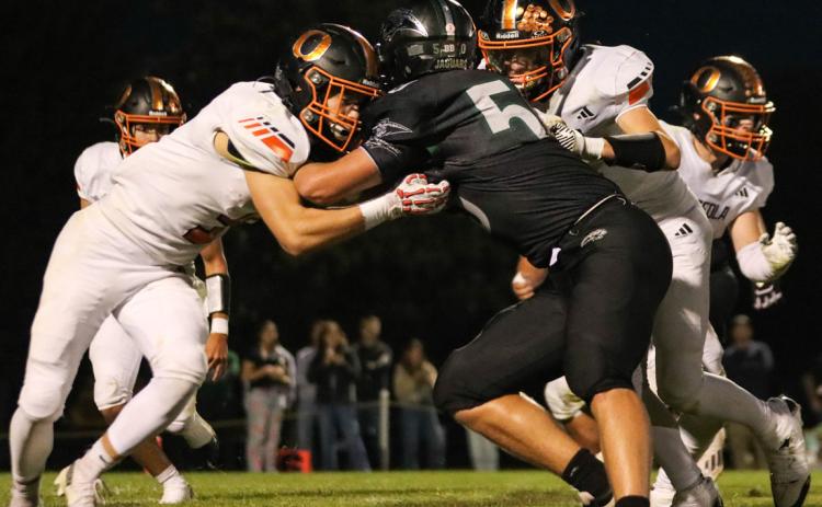 Brycen Kula and Landon Drozd set up the double team against thew Howells-Dodge defensive lineman on Friday night in Howells. PCN photo by Blaine Winslow.
