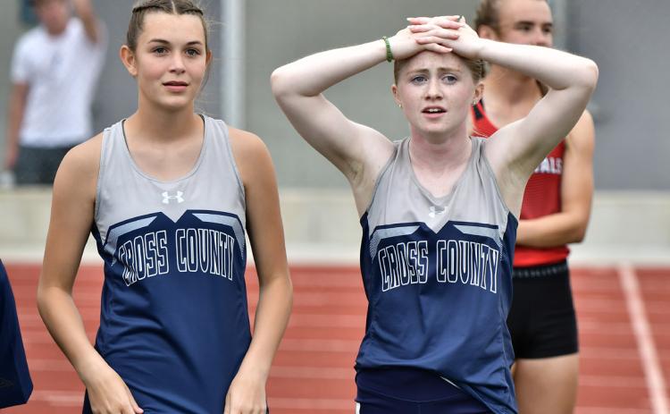 With her hands on her head after running third in the 100 meter finals at the C-6 District, Cross County freshman Piyper Berggren relaizes she would need to wait and see if her time was good enough to qualify for state. As it turned out her 12.39 (best of the year) was best among the non-automatic qualifiers in Class C. PCN photo by Rick Holtz