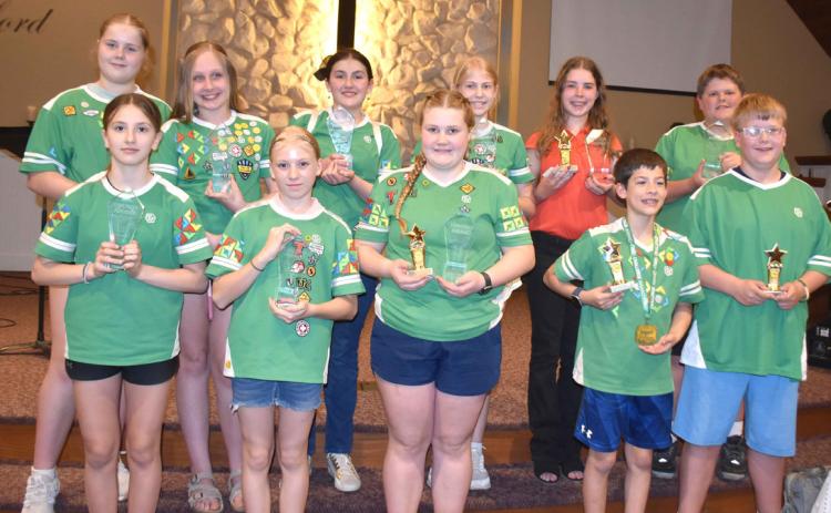 Pictured are AWANA Timothy award winners (clear trophy) and Clubbers of the year (gold star trophy): Taytum McLean, Serena Bauer, Cedar Johnson, Jackson Phillips, Sawyer Mundt; (back) Violet Peterson, Adelace Wilgocki, Penny Holtz, Evelyn Coffin, Addison King, and Sam Tonniges. PCN photo by Beth Sparrow.