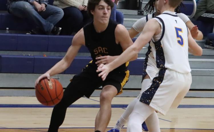 Shelby-RC junior Nixon Thelen (30) drives to the baseline and look for an open player at Nebraska Lutheran last week. Thelen scored 25 in the win over DC Scouts and 13 in the teams win at Dorchester. PCN file photo by Ken Kush.