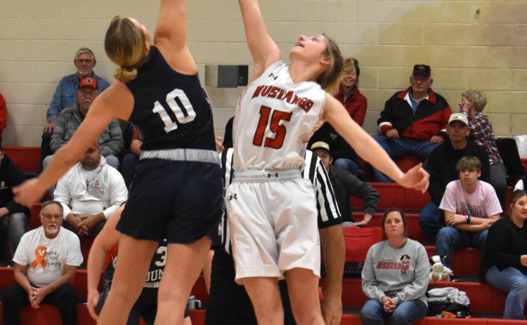 Lilly Peterson takes control of the ball at tip off of the girls’ basketball game against Meridian. PCN photo by Cienna Friesen.