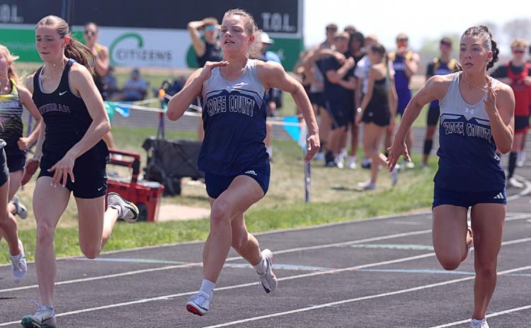Nebraska Lutheran’s Sam Hueske and Cross County’s Ansaldi VonHackewitz and Saphira Osentowski battle in a heat of the 100 meters in Friend. VonHackewitz was third and Osentowski seventh in the finals. Photo from Christian Horn, YNT.