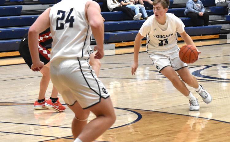 Ashton Seim dribbles it in while Alex Noyd helps on defense. PCN file photo.