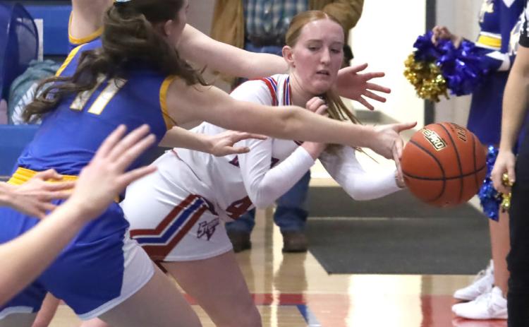 High Plains senior Peyton Hofmann is able to deliver the wraparound pass as the Knights defense pinches her to the baseline during Thursday’s game in Polk. PCN photos by Ken Kush.