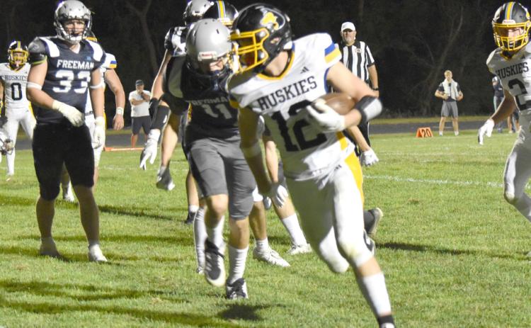 Shelby-RC Huskies junior Jett Vrbka (12) turns the corner and strolls into the endzone on the PAT run in Friday night’s season opener at Freeman High School. The Huskies picked up the 54-8 win. PCN photo by Beth Sparrow.