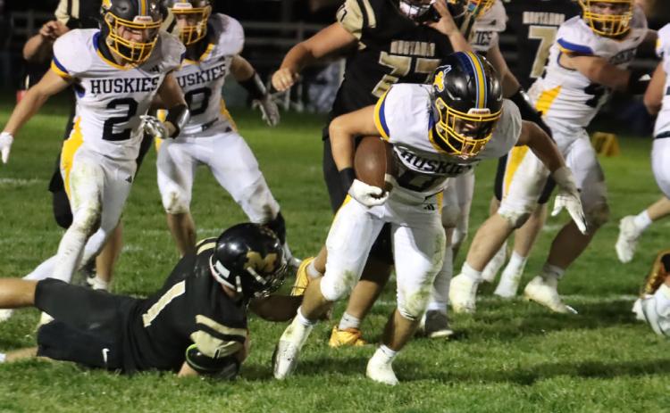 Shelby-RC Huskies junior running back Carter Eickmeier (0) runs out of the attempted shoestring tackle by McCool Junction senior Carson McDonald and sprints 48 yards to paydirt Friday night. PCN photo by Ken Kush.