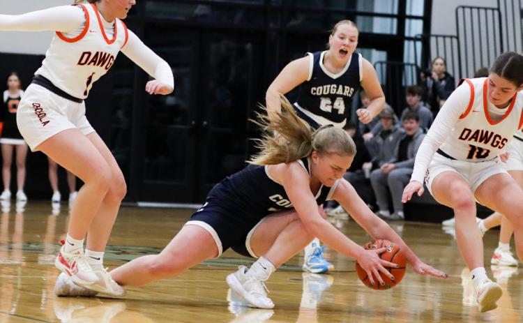 Ema Dickey (CC) dives for the ball while Emersyn Prososki (OSC), Addie Theis (OSC) and Chesney Sundberg (CC) are ready to help. PCN photo by Blaine Winslow.