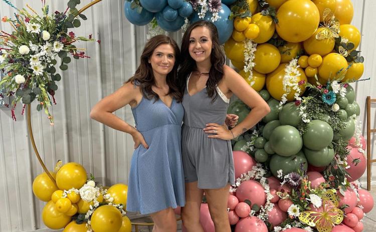 Best friends Valarie Marak and Emily Carlson recently started Balloon Bliss. They are pictured here at the Osceola Garden Tour. Photo provided.