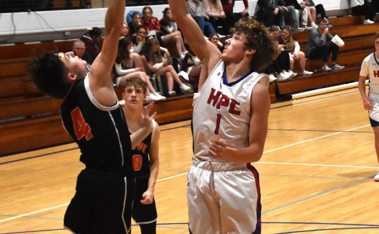 Brayden Santos (Osc) goes up against Collin Howell (HPC) for a rebound. PCN photo by Beth Sparrow.