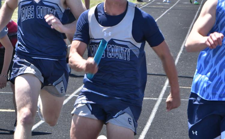 Cross County’s Jed Berggren exchanges the baton with Zaeden Hughes in the 4X100 relay at the Cross County Invite last Thursday. PCN photo by Rick Holtz.