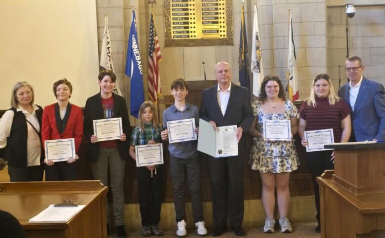 Above: Governor Jim Pillen (right) proclaims library week and awards young Nebraska writers. Photo provided.