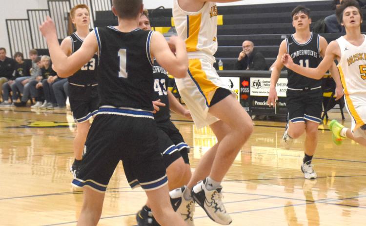 Dalton Pokorney cuts between defenders on his way to a shot against Exeter-Milligan. PCN photo by Beth Sparrow