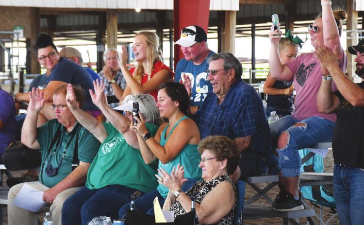 Daphne Mentink had quite the cheering section for her at this year's fair. The section included siblings, parents, grandparents, great-grandparents, aunts, uncles and cousins. Polk County News photo by Rick Holtz