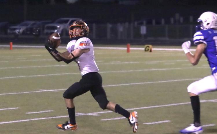 Osceola senior Brayden Santos hauls in a 48-yard completion in the first half leading to the Bulldogs first touchdown two plays later. Santos caught a 50-yard scoring strike in the second half. PCN photo by Ken Kush.