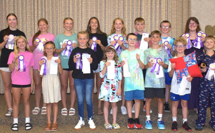 The Quilting and Modeling portion of the Polk County Fair was held Monday night at the Midwest Covenant Home. Here the contestants display their ribbons won during the contest. PCN photos by Beth Sparrow.