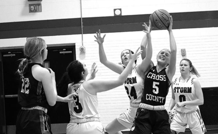 Lady Cougar Bren Lemburg (#5) tries to keep the ball away from the Storm players (#3 Roberta Hines and #24 Rylee Ackerson). Photo by Angie Hild.