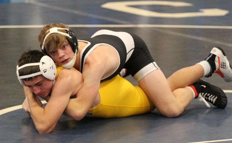 Above: Devin Nuttelman (CCO) wrestles Traven Reznicek (SRC). Nuttelman pinned him in 1:11. Below: Jed Berggren (left) wrestled Daugherty of Lakeview. PCN photos by Travis Lane.
