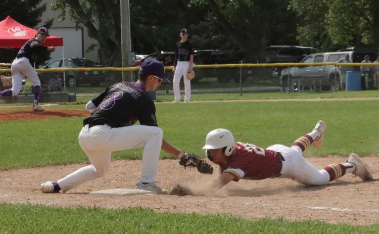 SOS starting pitcher Brayden Santos delivered a perfect pick-off throw and Kelby Neujahr (8) slapped the tag down on the DCB base runner for the out at first. PCN photo by Ken Kush.