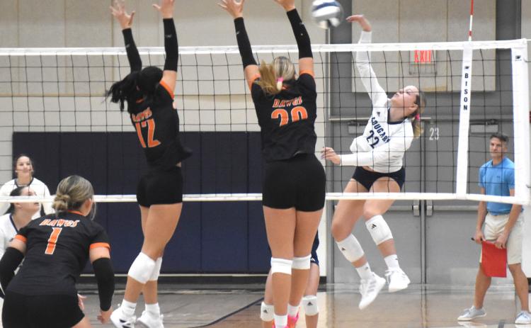 Cross County senior Sydney Hengelfelt is on the attack against the Osceola block set up by Alexis Burritt and Graci Conkling. PCN photo by Beth Sparrow.