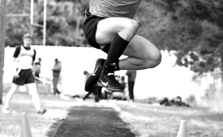 Bulldog Alexx Winkelman jumping in the triple jump event at conference track last week.