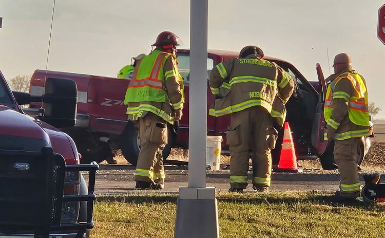 Above: Firemen help with a 2-car accident Tuesday afternoon at Cross County. Photo provided.
