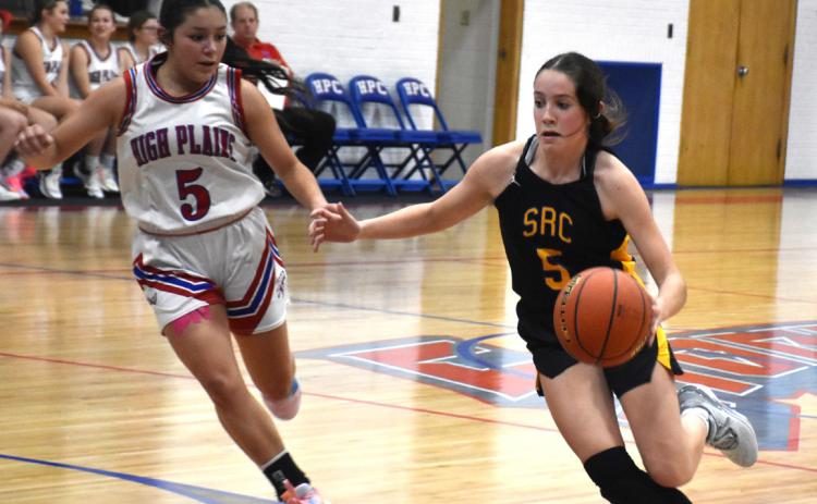 Kaleigh Ruth (SRC) dribbles the ball around Gahvi Lesiak (HPC). PCN file photo by Alex Larmon.