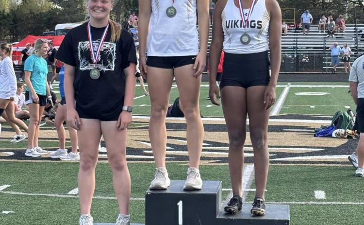 Janna Roberts (left) of Osceola, placed third in pole vault at the Central Nebraska Track championships in Grand Island. The first and second place girls were from GI Northwest. Photo provided.
