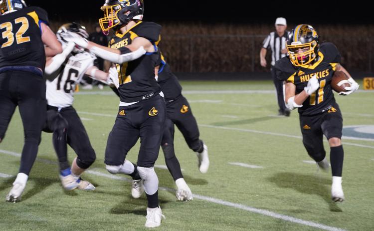 Above: Carter Eickmeier (#11, right) of Shelby-Rising City reached 1000 yards for the season at the game against McCool Junction last Friday. Credit to the offensive line for blocking so he could attain this goal. PCN photo by Jen Vrbka