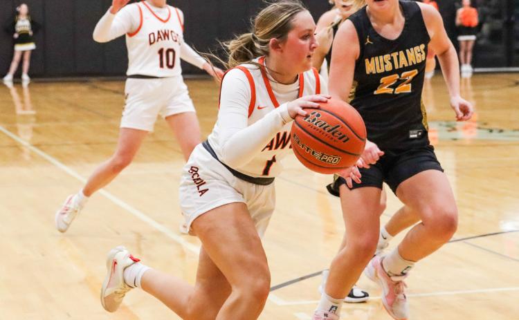 Emersyn Prososki dribbles the ball past a Mustang in their game last week. PCN photo by Blaine Winslow.